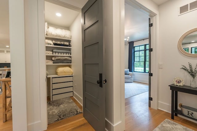 corridor featuring light hardwood / wood-style flooring