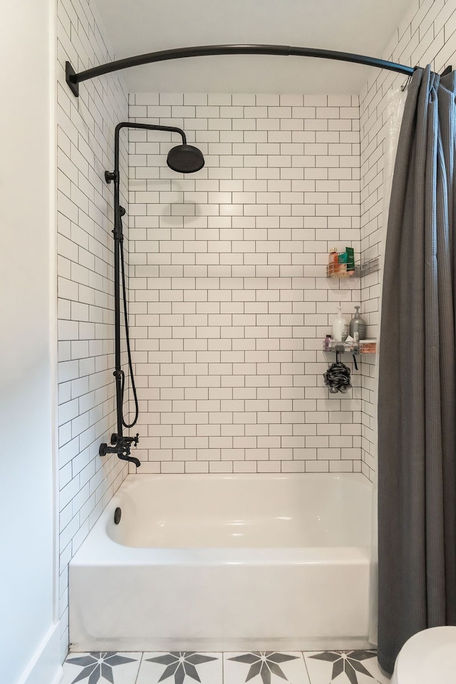 bathroom featuring tile patterned flooring and shower / bath combination with curtain