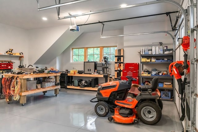 garage with a workshop area and a garage door opener