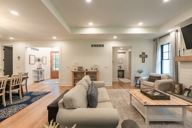 living room with light hardwood / wood-style floors