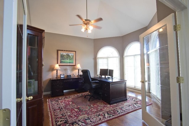 office area featuring french doors, ceiling fan, hardwood / wood-style floors, and vaulted ceiling