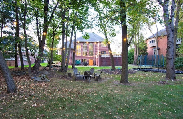 view of yard with a trampoline