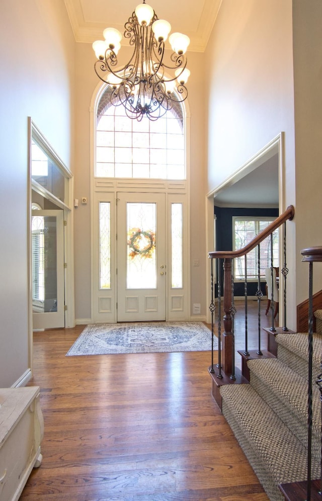 755 Majestic, Rochester Hills, MI 48306 - foyer with an inviting chandelier, ornamental molding, stairs, and a towering ceiling