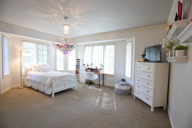 carpeted bedroom with ornamental molding