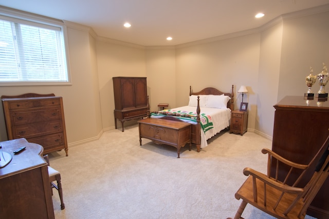 carpeted bedroom with ornamental molding