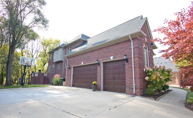 755 Majestic, Rochester Hills, MI 48306 - view of side of property with brick siding, roof with shingles, and driveway