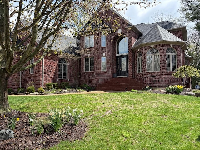 755 Majestic, Rochester Hills, MI 48306 - view of front of house featuring roof with shingles, a front lawn, and brick siding