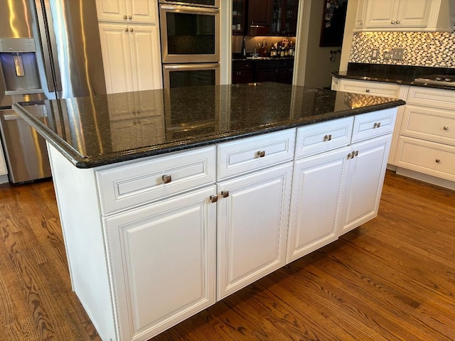 755 Majestic, Rochester Hills, MI 48306 - kitchen featuring white cabinets, a kitchen island, stainless steel appliances, and dark wood-type flooring