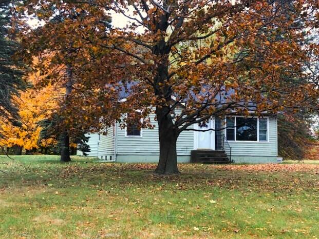 2399 S Cleveland Ave, Saint Joseph, MI 49085 - view of property hidden behind natural elements with a front yard and entry steps