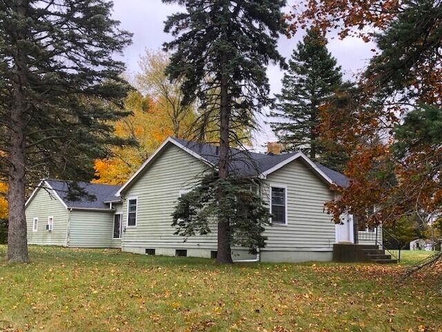 2399 S Cleveland Ave, Saint Joseph, MI 49085 - view of home's exterior with a lawn and a chimney