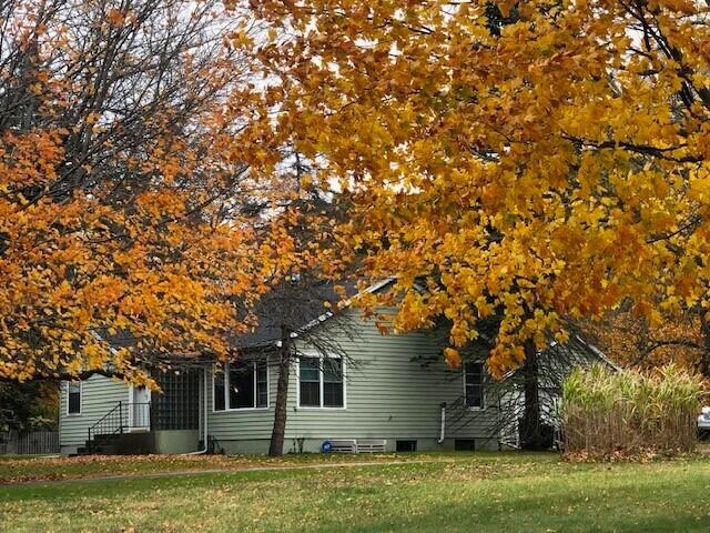 2399 S Cleveland Ave, Saint Joseph, MI 49085 - view of side of home featuring a yard