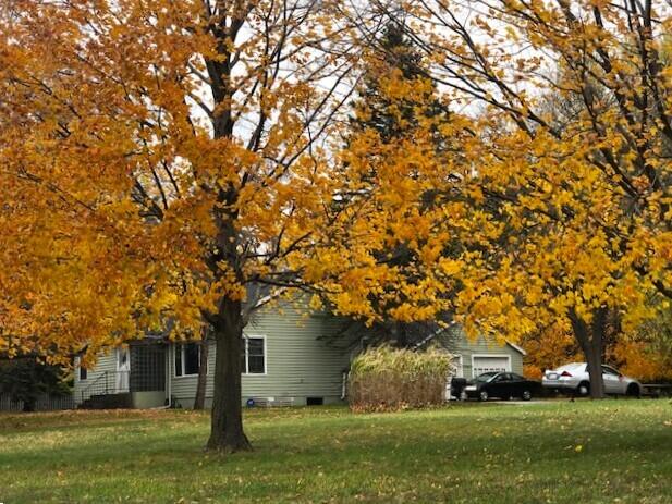 2399 S Cleveland Ave, Saint Joseph, MI 49085 - view of property exterior with a yard, a garage, and crawl space