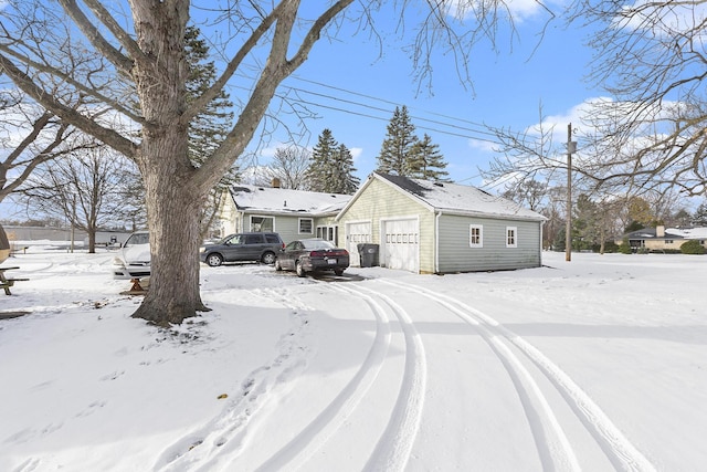2399 S Cleveland Ave, Saint Joseph, MI 49085 - view of snow covered exterior with a detached garage