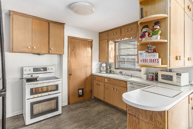 2399 S Cleveland Ave, Saint Joseph, MI 49085 - kitchen with range with two ovens, white microwave, light countertops, dark wood-type flooring, and open shelves