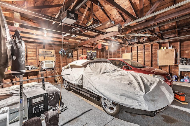 2399 S Cleveland Ave, Saint Joseph, MI 49085 - garage with wood walls and a garage door opener