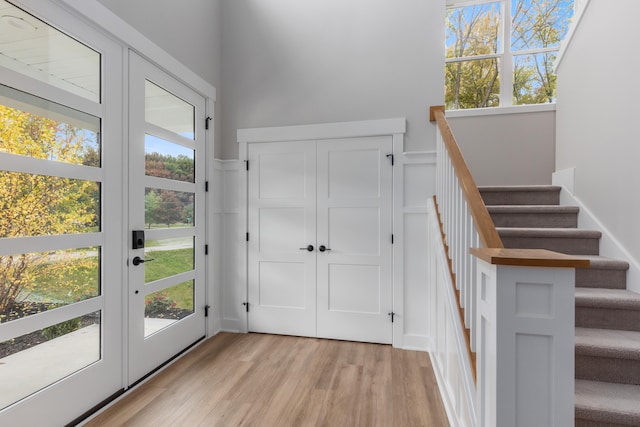 foyer featuring french doors and light wood-type flooring