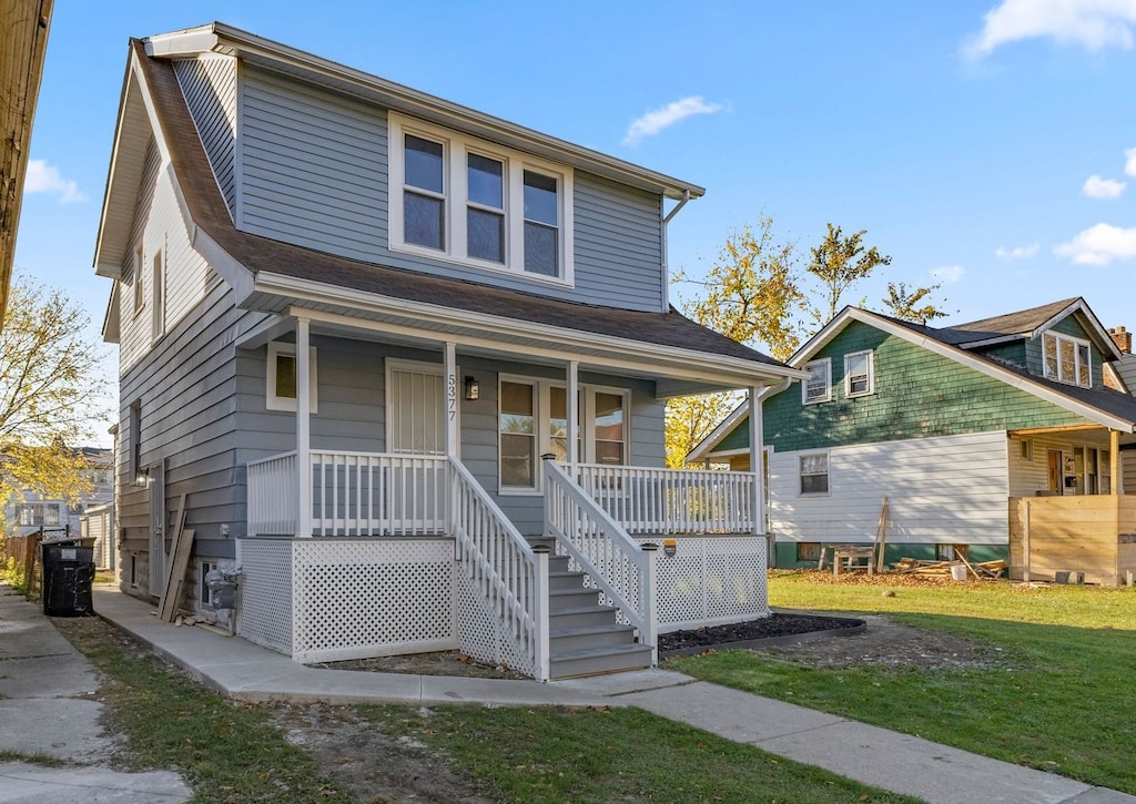 view of front of home with a front lawn and a porch