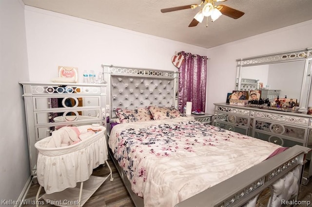 bedroom featuring ceiling fan, dark hardwood / wood-style floors, ornamental molding, and a textured ceiling