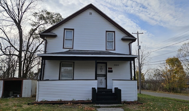 view of front property with a storage unit