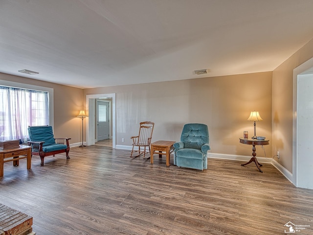 sitting room featuring hardwood / wood-style flooring