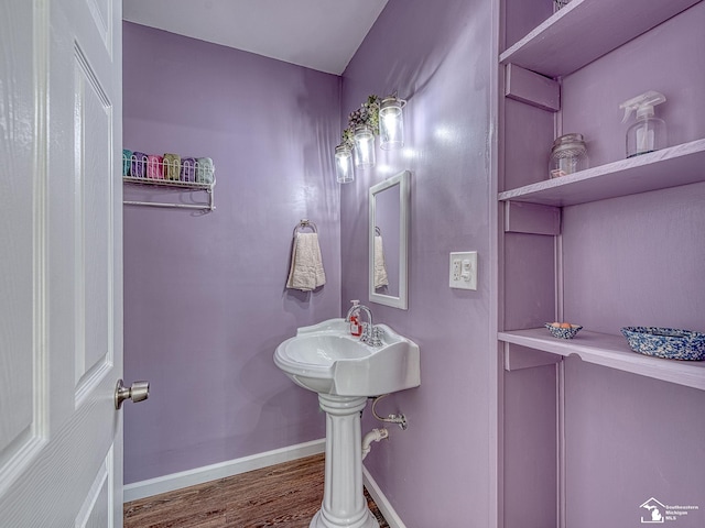 bathroom with hardwood / wood-style floors