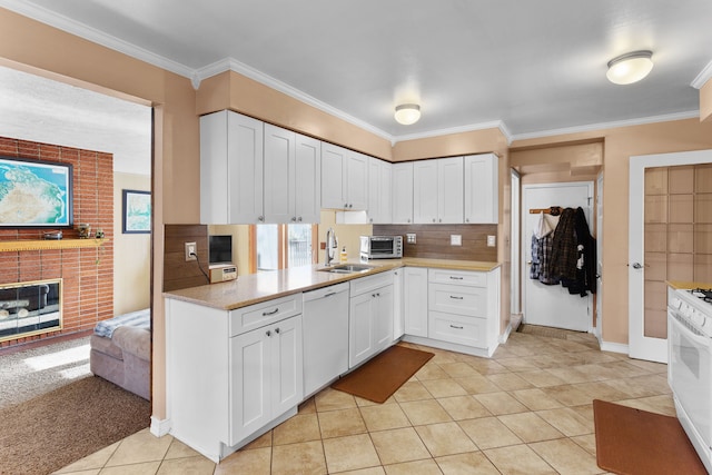 kitchen featuring white appliances, white cabinetry, crown molding, and backsplash