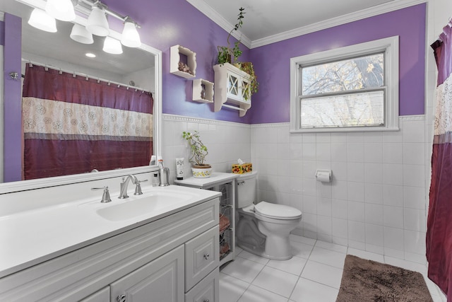 bathroom with vanity, tile patterned floors, crown molding, toilet, and tile walls