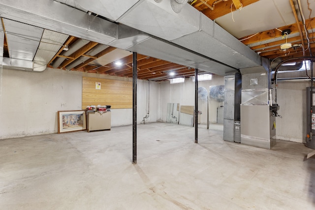 basement with heating unit and water heater