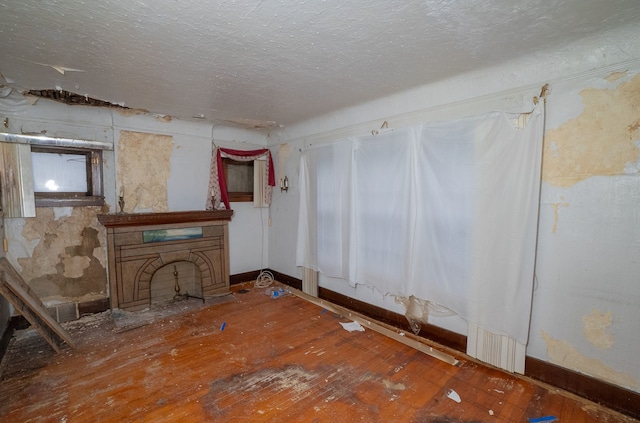 unfurnished living room featuring hardwood / wood-style flooring