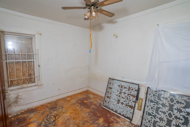 unfurnished room with ceiling fan and ornamental molding