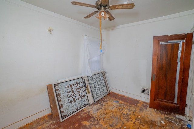 spare room with ceiling fan and crown molding