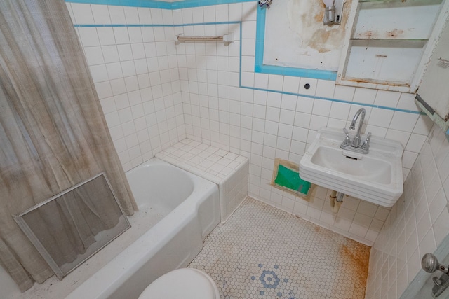 bathroom featuring sink, toilet, tile walls, and tile patterned floors