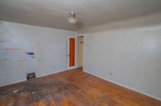 spare room featuring hardwood / wood-style flooring