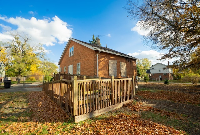 view of property exterior featuring a deck