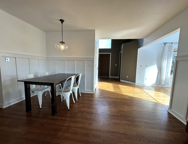 unfurnished dining area featuring dark hardwood / wood-style flooring