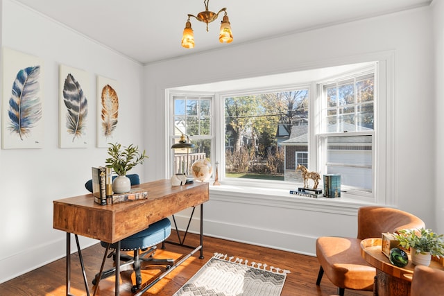 office area with ornamental molding, hardwood / wood-style flooring, and a notable chandelier