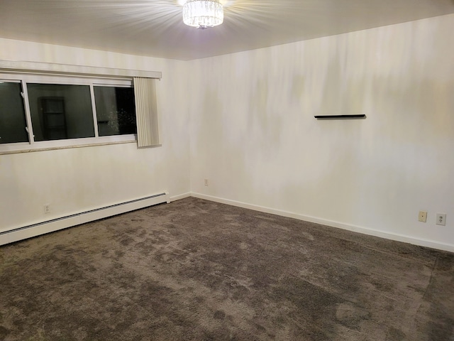 carpeted spare room with baseboard heating