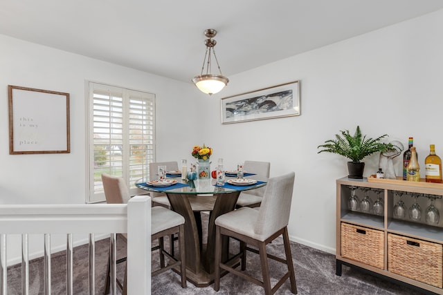 view of carpeted dining area