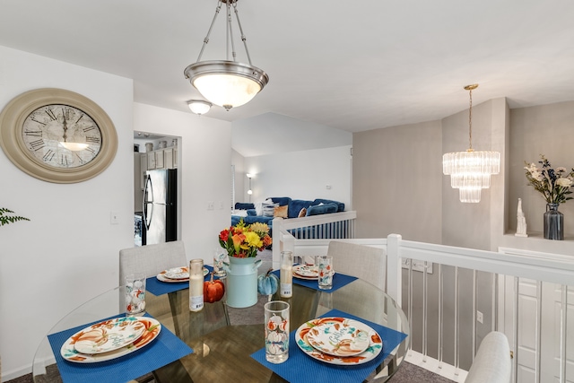 dining room featuring a chandelier and hardwood / wood-style flooring