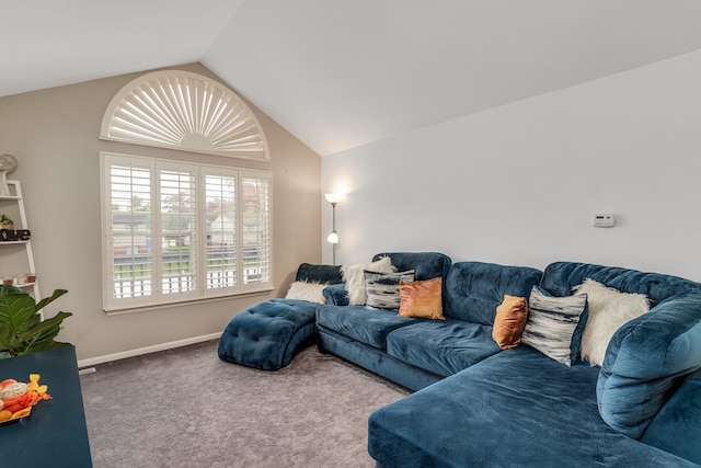 carpeted living room featuring vaulted ceiling