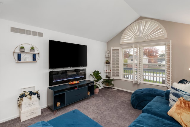 living room featuring carpet flooring and lofted ceiling