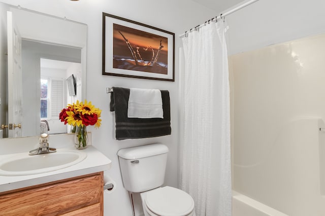 full bathroom featuring vanity, toilet, and shower / tub combo with curtain