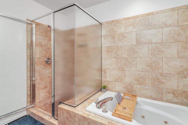 bathroom with shower with separate bathtub