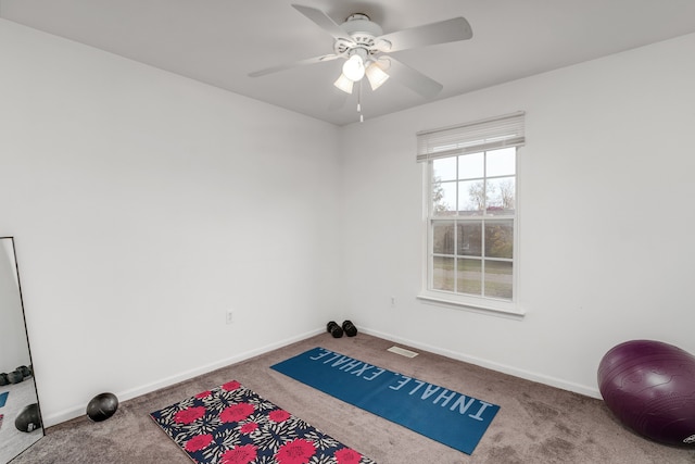 exercise area with carpet floors and ceiling fan