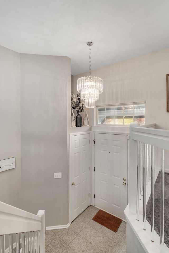 entrance foyer with an inviting chandelier