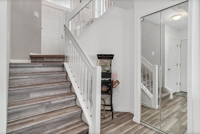 stairway featuring wood-type flooring