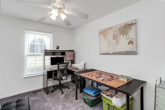 carpeted home office with ceiling fan