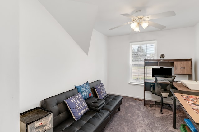 carpeted home office featuring ceiling fan