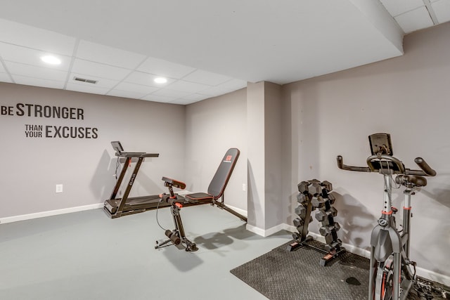 exercise room featuring a drop ceiling