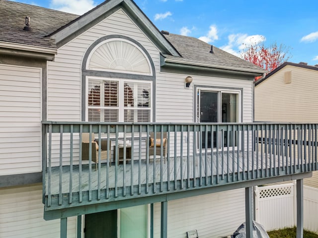 back of property featuring a balcony